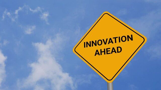 Innovation Ahead Road Sign on Clear Blue Sky with Rapid Moving Clouds for Text Placement