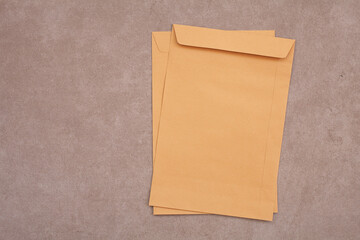 brown paper bag,brown envelope front and back isolated on gray background. View from the letter.