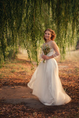 Fototapeta premium Photo of a beautiful bride with a wedding bouquet.
