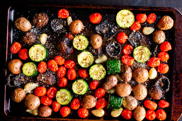 Italian Oven Roasted Vegetables on a Sheet Pan: Roasted grape tomatoes, zucchini, mushrooms, red...