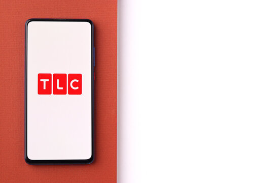 Assam, india - June 21, 2021 : TLC logo on phone screen stock image.