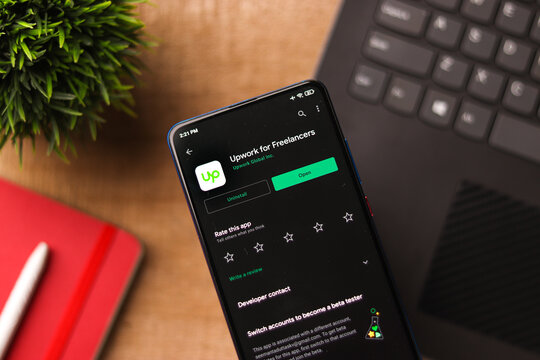 Assam, india - November 29, 2020 : Up work logo on phone screen stock image.