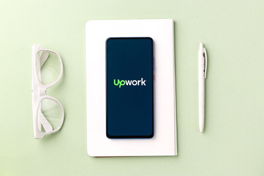 Assam, india - November 29, 2020 : Up work logo on phone screen stock image.