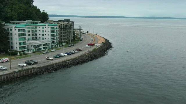 Aerial: Alki Beach front and apartments. Seattle, Washington, USA
