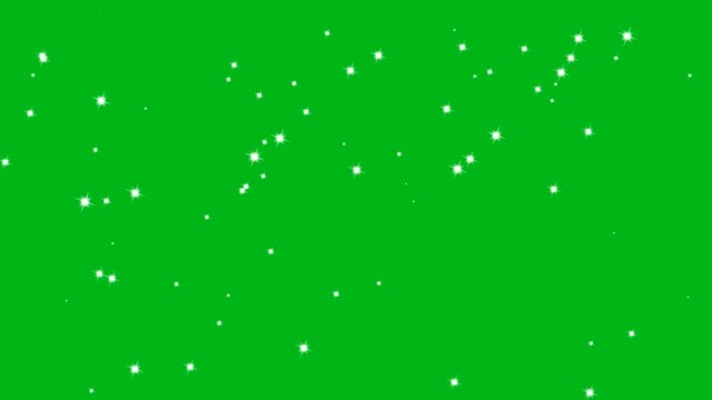 Little white sparkles shining on a green screen video