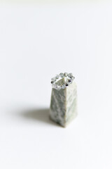 handmade ring on a pyramid on a white background. handmade jewelry from beads.