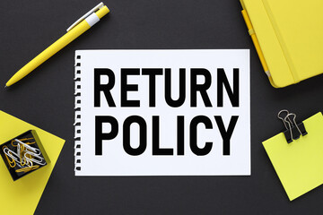 Refund Policy. text on a black background, on white paper, next to bright stickers and a yellow pen