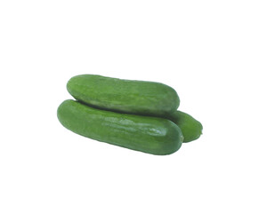 three organic fresh green young cucumbers isolated on a white background