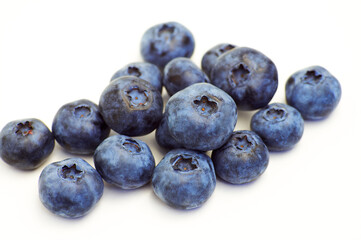 Handful of blueberries isolated on white background