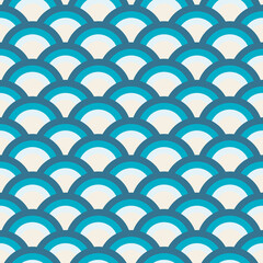 Art Deco seamless pattern in blue tones for modern fabrics, trendy textiles, decorative pillows. Many multi-colored circles are stacked like scales. 