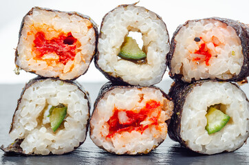 Cucumber with wasabi hosomaki roll and red pepper hosomaki roll , traditional Japanese food.