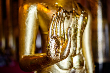 Golden Buddha statue in thai temple, Chiang mai, Thailand