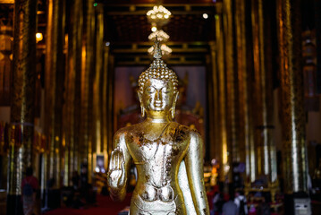 Golden Buddha statue in thai temple, Chiang mai, Thailand