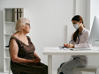 elderly woman patient nurse communication hospital treatment