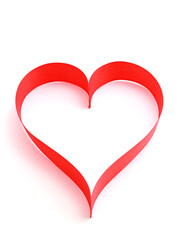 Red satin ribbon heart on white background