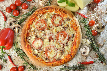 meat pizza with cheese tomato and mushrooms on wooden table with ingredients background.top view