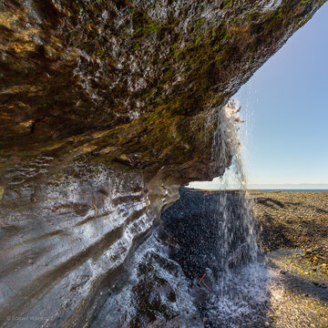 Rock formations and waterfall at Sandcut Beach, near Shirley on Vancouver Island, British Columbia, Canada