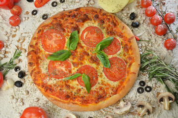 pizza with mushrooms tomato and cheese. served on wooden table with ingredientstop view