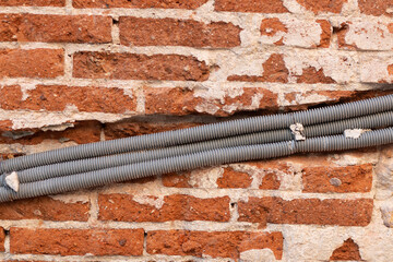 pipework embedded in brick wall