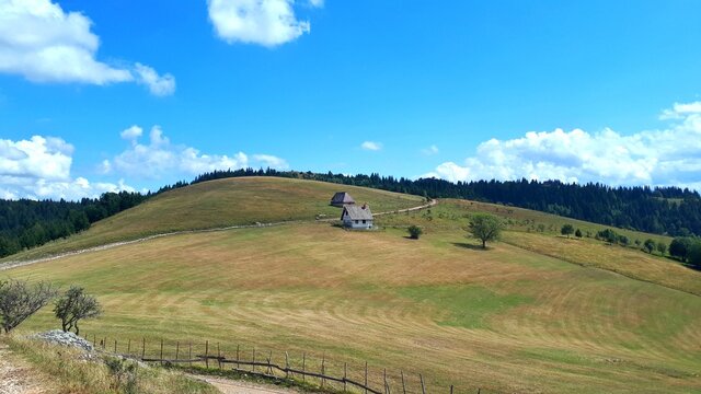 Mountain Ozren landscape with small houses and golden meadows, Bosnia and Herzegovina