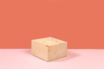 Empty pink table with wood saw cut for product presentation, rustic style, minimal ecological...