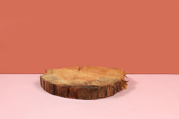 Empty pink table with wood saw cut for product presentation, rustic style, minimal ecological...