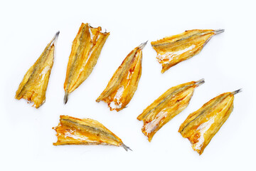 Sun dried black kingfish on white background.