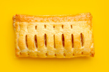 Pineapple pie on yellow background.