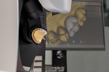 CAD CAM equipment modern extraoral laboratory dental scanner. Selective focus.