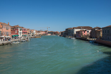 The vessel is on the canal in Murano, ,Architecture of buildings in Murano Island, Venice, Italy, 2019