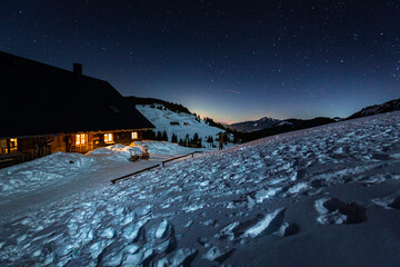 Germany, Bavaria, Allgaeu Alps, winter night scene with old mountain hut
