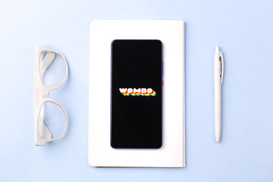 Assam, india - April 10, 2021 : Wombo ai logo on phone screen stock image.