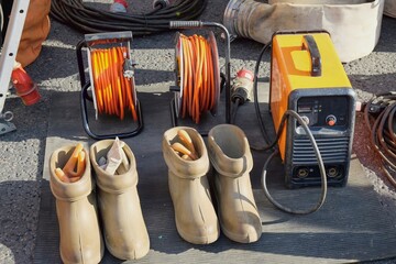Special dielectric rubber boots and gloves designed to work with high voltage.High voltage protective insulating shoes and gloves