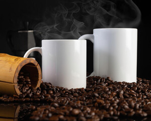 Mock up of 11 oz and 15 oz white glossy coffee mugs on dark background with coffee beans, and...