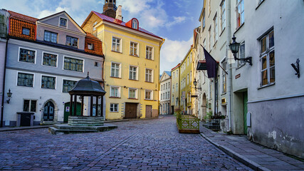 Fototapeta na wymiar Medieval square at sunrise with old colored houses. Tallinn Estonia.