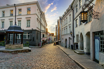 Alley of medieval houses at sunset in the city of Tallinn Estonia.