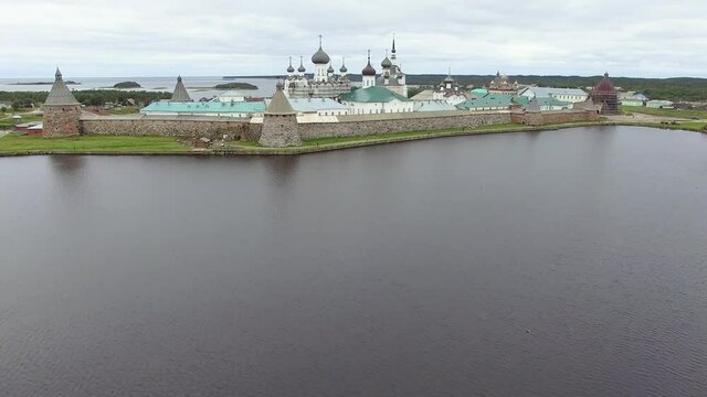 Solovki Russia kremlin aerial drone footage, tourism of north White Sea, close to tower 4K