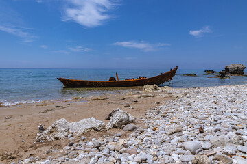 Shipwreck in Agios Gordios holiday resort village on west coast of Corfu Island, Greece