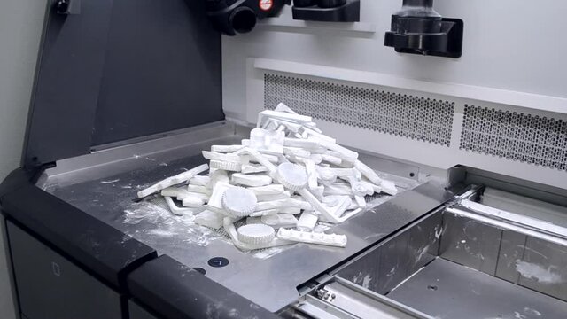 Objects and models printed on industrial 3D printer from white plastic powder
