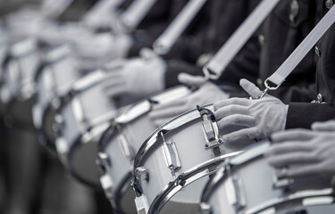 Military drummers play drums. Close-up selective focus.