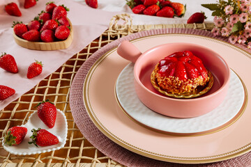 small strawberry and chopped chestnuts tart set in a pink ceramic pot. Beautiful and romantic setting in light pink tones. valentine´s day concept.