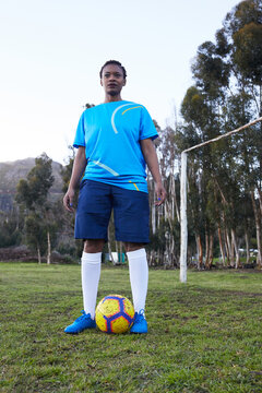 Black woman playing soccer