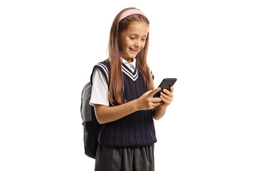 Excited young schoolgirl using a smartphone