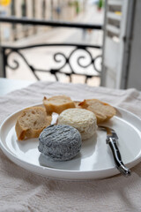 Cheese collection, french goat cheese crottin served with french bread