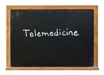 Telemedicine written in white chalk on a black chalkboard isolated on white