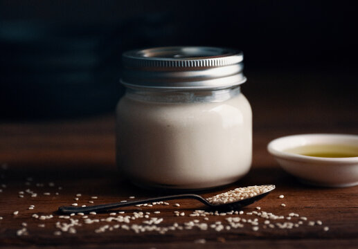 Creamy White Tahini Sauce In Glass Jar
