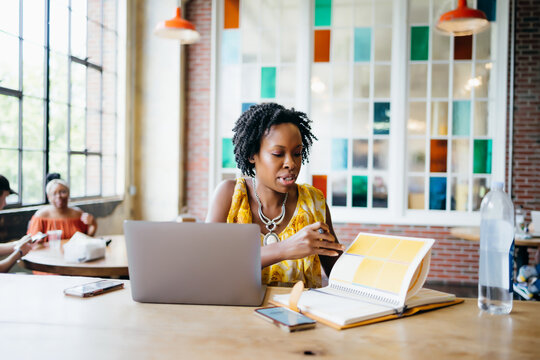 African American woman working at a local cafe