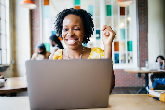 Black woman on video call at cafe