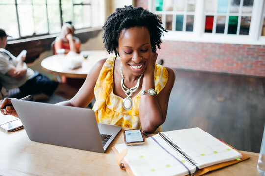 African American woman working at a local cafe