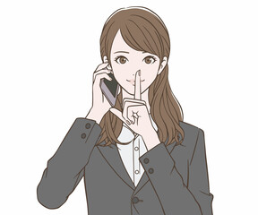 スマートフォンを持ち、人差し指を口に当てるスーツの女性